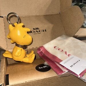 Coach X Penuts Woodstock signature silk bandana and collectible bag charm